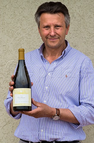 Gianfranco Gallo winemaker of Vie di Romans with bottle of his Chardonnay  Mariano del Friuli Italy Friuli Isonzo