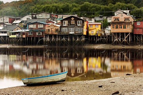 Palafito houses stilts in the tidal bay at Chiloe Patagonia Chile