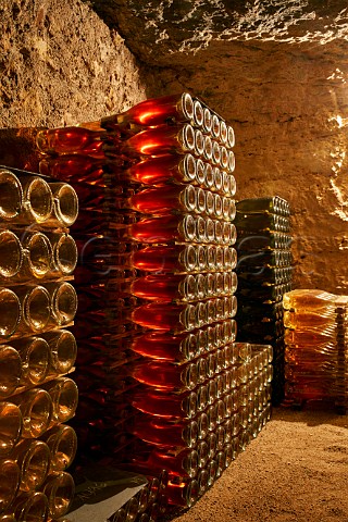 Bottles of wine ageing in cellar of Domaine de la Taille aux Loups which has been dug out of the tuffeau subsoil Husseau IndreetLoire France  MontlouissurLoire