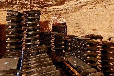 Bottles of sparkling wine ageing in cellar of Domaine de la Taille aux Loups which has been dug out of the tuffeau subsoil Husseau IndreetLoire France  MontlouissurLoire