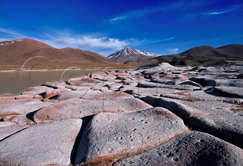 Piedras Rojas Red Rocks with dormant volcano in distance San Pedro de Atacama Atacama Desert Chile