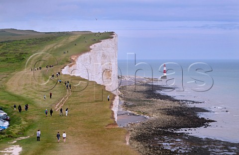 People on the South Downs Way footpath near Beachy Head Eastbourne Sussex England