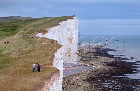 People on the South Downs Way footpath near Beachy Head Eastbourne Sussex England