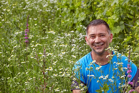 Raphal StGermain in organic Petite Arvine vineyard Domaine StGermain StPierre dAlbigny Savoie France