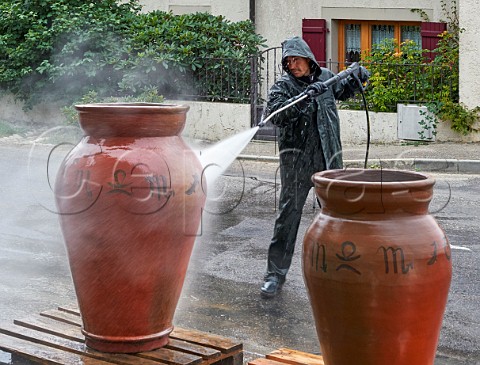 Washing amphorae to remove old beeswax prior to them being resealed ready for the new vintage Les Vignes de Paradis Marcorens Ballaison HauteSavoie France