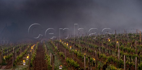 Oil burning smudge pots in vineyard of Chteau La Gaffelire during subzero temperatures of April 2017 Stmilion Gironde France Saintmilion  Bordeaux
