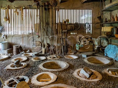 Buried qvevri clay fermentation vessels in the winery of Archil Guniava many of which are over 50 years old  Kvaliti Imereti near Zestaponi Georgia