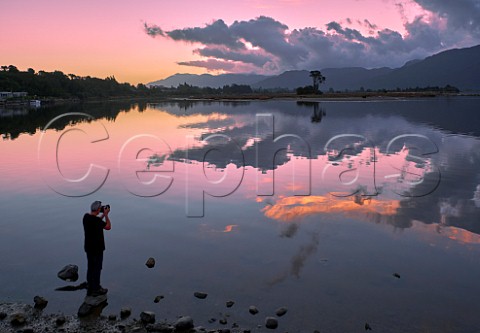 Photographer at sunset at Collingwood on Golden Bay Nelson Tasman New Zealand