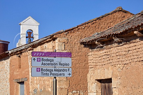 Signs to wineries by traditional buildings on the Ruta del Vio in Pesquera de Duero Castilla y Len Spain  Ribera del Duero