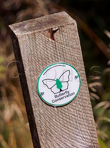 Marker post in Oaken Wood the Butterfly Conservation reserve in Chiddingfold Forest Surrey England
