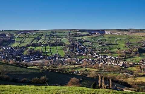 Village of Bradwell surrounded by fields with drystone walls Peak District National Park Derbyshire England