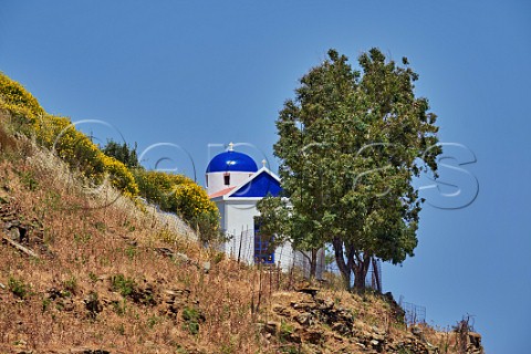 Hillside chapel above village of Aetofolia Tinos Greece