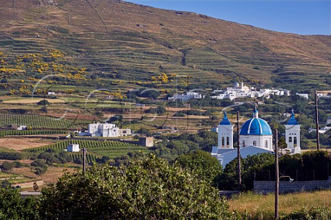 Holy TrinitySt John church at Falatados with vineyards of Vaptistis on left and Tzados village beyond Tinos Greece