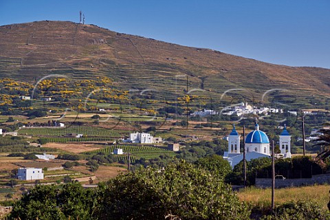 Holy TrinitySt John church at Falatados with vineyards of Vaptistis on left and Tzados village and Mount Kechrovouni beyond Tinos Greece