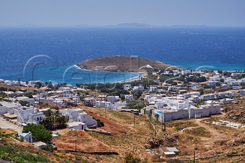 View over Ormos Agiou Ioannou with island of Mykonos in distance Tinos Greece
