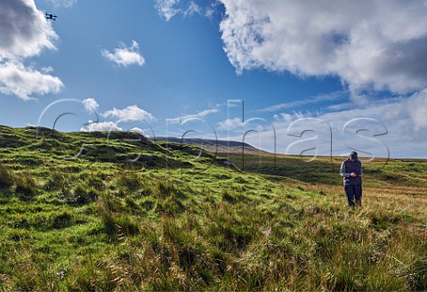 Man flying a drone Yorkshire Dales National Park England