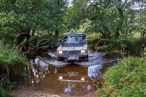 Car fording a stream near Marsett Yorkshire Dales National Park England