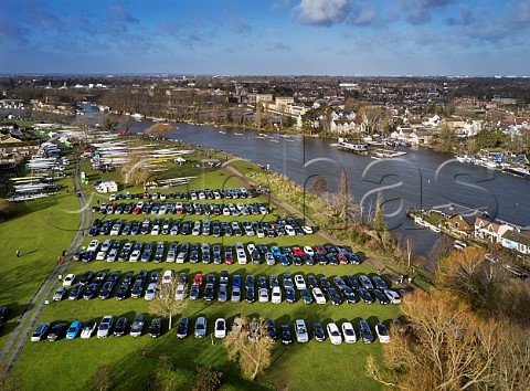 Cars and boats on Hurst Park for the Hampton Head rowing races on the River Thames West Molesey Surrey England