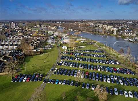 Cars and boats on Hurst Park for the Hampton Head rowing races on the River Thames West Molesey Surrey England