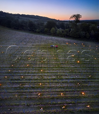 Candles burning on a frosty spring morning at Albury Vineyard Silent Pool Albury Surrey England