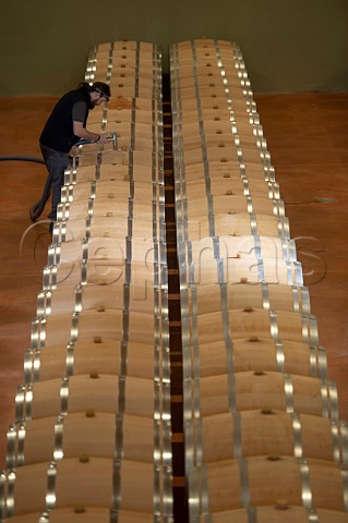 Cyril Meyrou filling new oak barriques in the cellar of Chteau Richelieu Fronsac Gironde France   Fronsac  Bordeaux