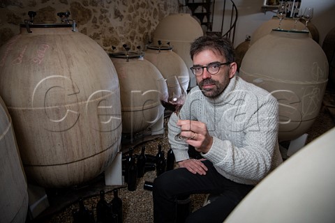 Loc Pasquet with his amphorae in winery of Liber Pater  Landiras Gironde France Graves  Bordeaux