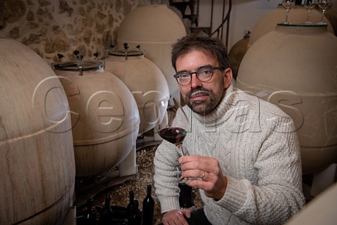 Loc Pasquet with his amphorae in winery of Liber Pater  Landiras Gironde France Graves  Bordeaux