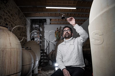 Loic Pasquet with his amphorae in winery of Liber Pater  Landiras Gironde France Graves  Bordeaux