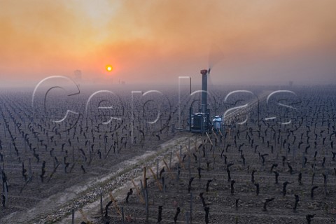 Antifrost wind machine in vineyard at dawn during subzero temperatures of 7 April 2021 Pomerol Gironde France Pomerol  Bordeaux
