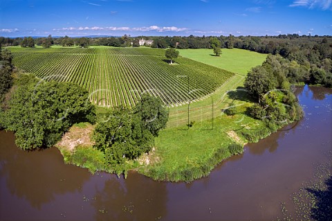Coolhurst Vineyards viewed over Birchenbridge Forge Pond formed by damming the River Arun Mannings Heath Sussex England