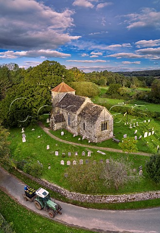 Harvested Pinot Blanc grapes passing the 11thcentury church of St Mary the Virgin on their way to the winery of Stopham Estate Stopham Sussex England