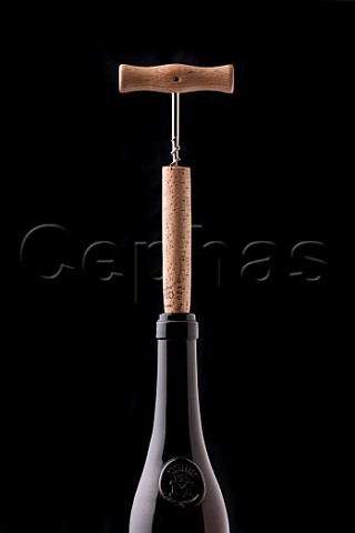 Pulling a very long cork from a wine bottle