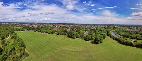 Neilson Recreation Ground with River Ember on right and River Mole hidden in trees with London skyline visible on horizon  East Molesey Surrey England