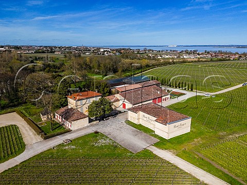 Chteau HautBages Libral and its vineyards in spring with the Gironde Estuary in distance  Pauillac Gironde France Mdoc  Bordeaux