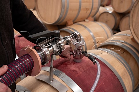 Racking wine from tank to barrels at Chteau GrandPuyDucasse Pauillac Gironde France Mdoc  Bordeaux