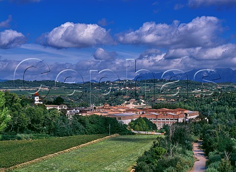 The bodegas of Codorniu by the Anoia river with the Sierra de Montserrat in distance Sant Sadurni dAnoia Catalonia Spain Penedes